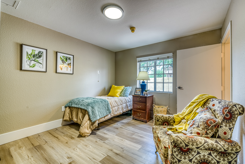 bedroom with recliner chairs